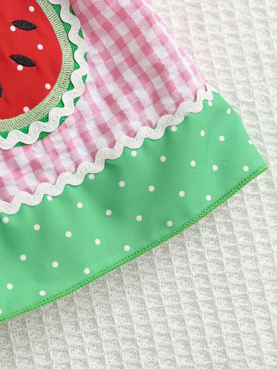 Baby dress with pink gingham, watermelon pocket, green polka dot hem, and white trim.