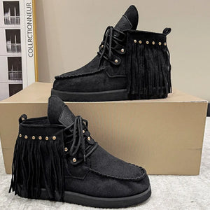 Black fringed moc-toe ankle boots with gold stud detail and laces.