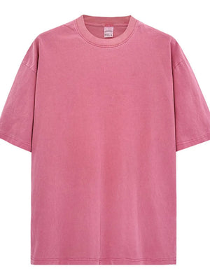 Oversized pigment-dyed crewneck tee in pink with a relaxed fit and crew neckline.