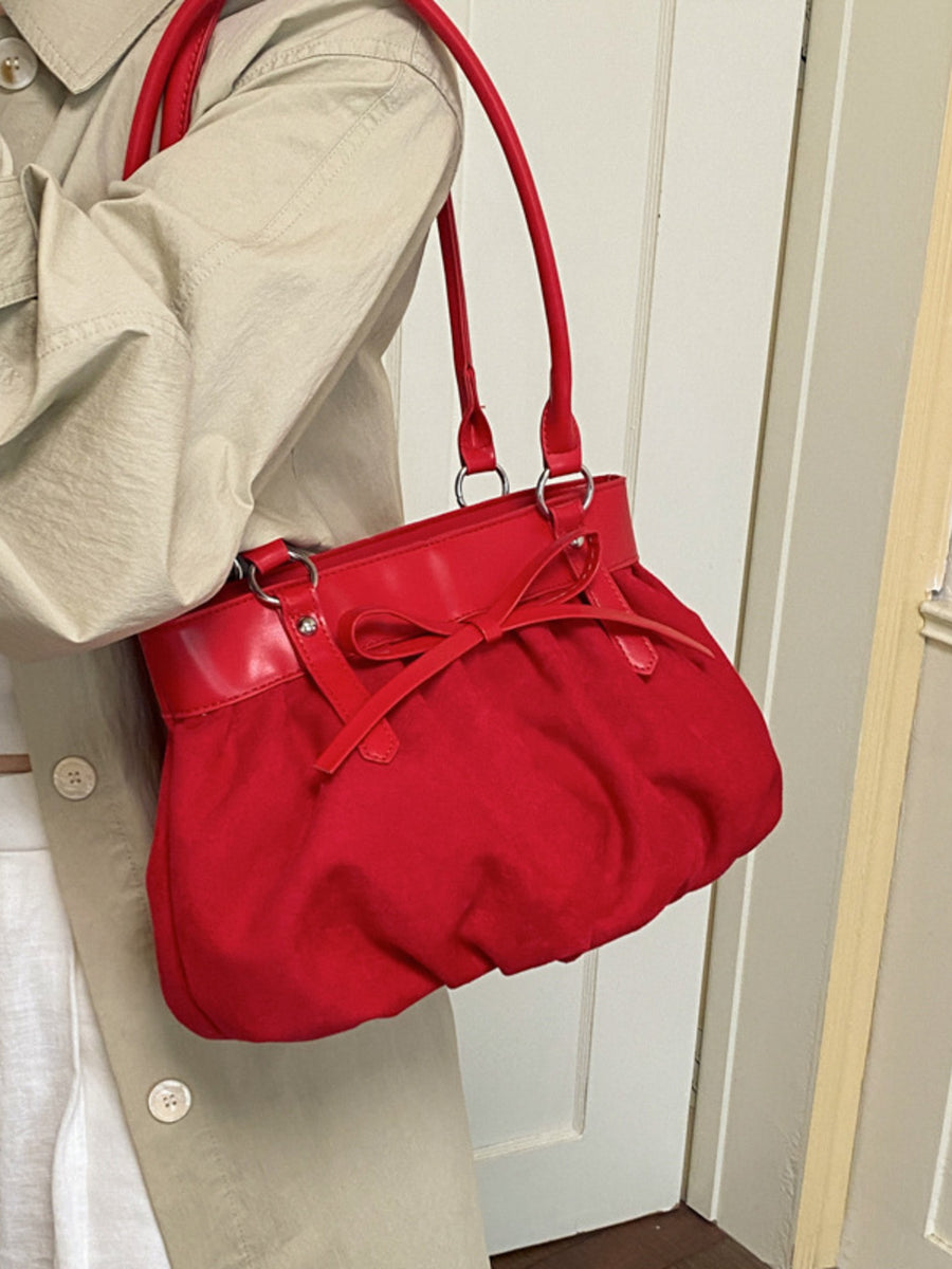 Bow-Decorated Ruched Shoulder Bag in black with bow detail