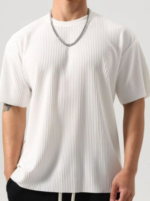 White oversized t-shirt with sculpted vertical pleats and a crew neck.