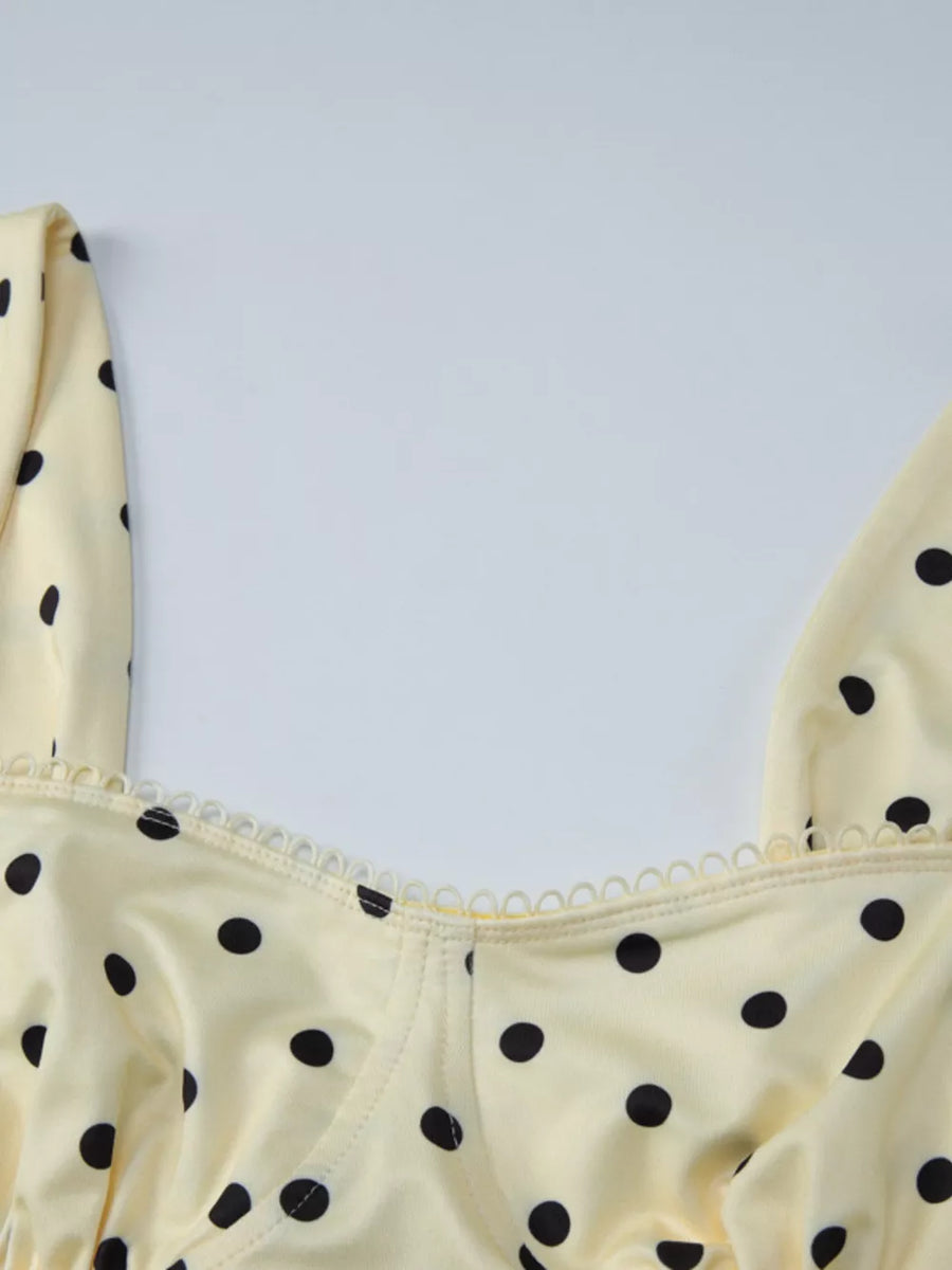 Pastel yellow polka dot tank top with sweetheart neckline and scalloped trim.