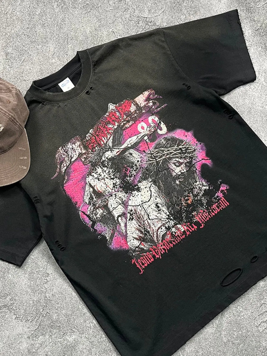 Black oversized ripped graphic tee with Jesus crucifixion print and distressed details.
