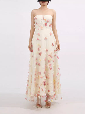 Strapless ivory tulle maxi dress with 3D floral appliques and a sweetheart neckline.