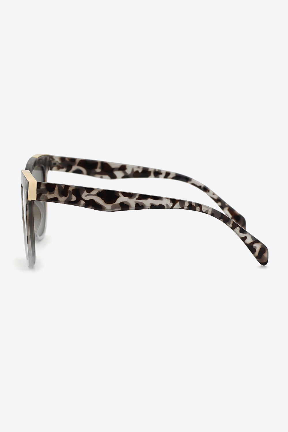 Leopard print angular frame sunglasses in light gray with gold accents.