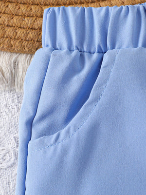 Baby blue cotton shorts with elastic waistband and pocket detail