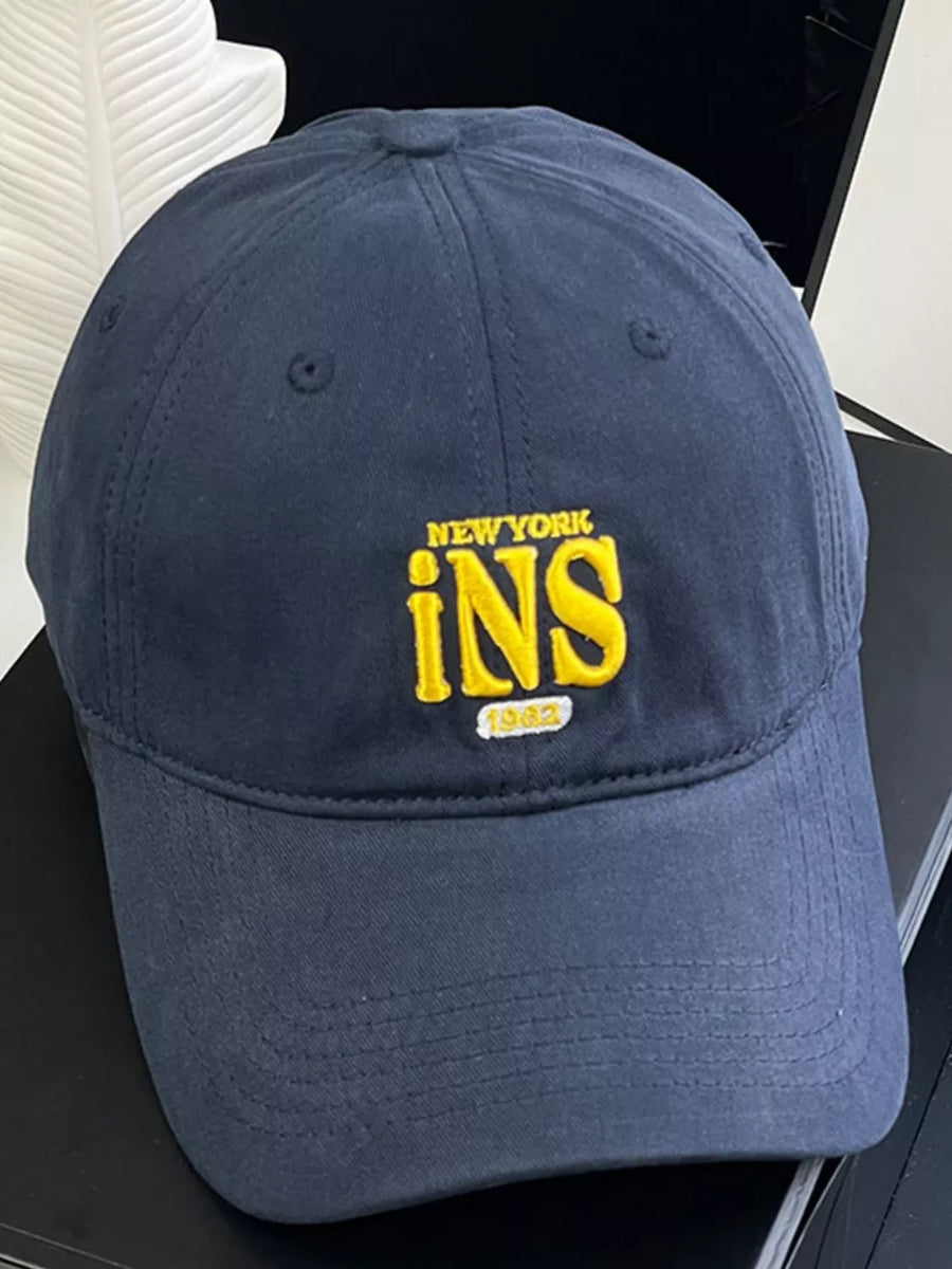 Navy baseball cap with yellow New York INS 1962 embroidery