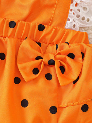 orange romper with bow and ruffle sleeve
