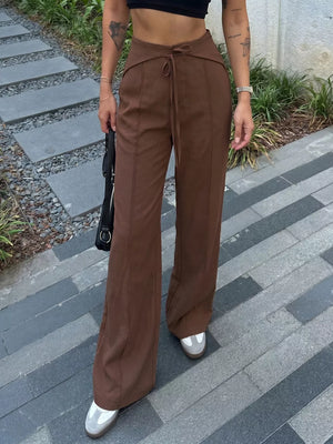 100% polyester Care instructions: Machine wash cold wide-leg pants in Brown with flared silhouette
