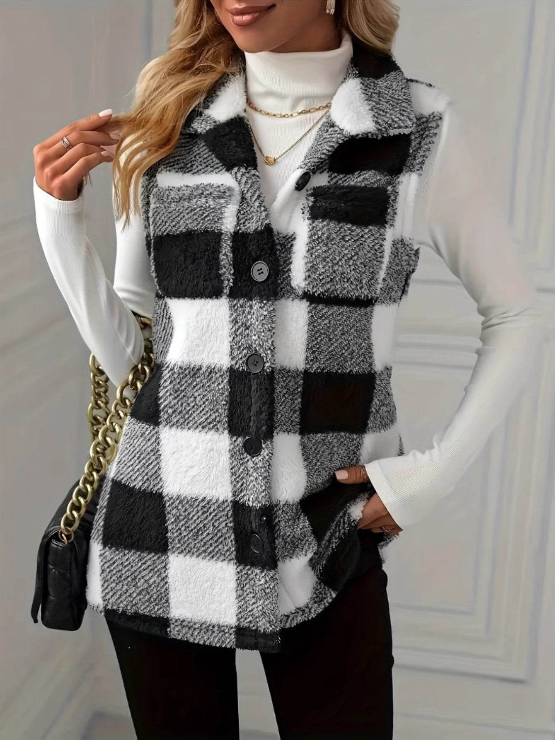 Textured black and white buffalo check buttoned vest jacket with collar.