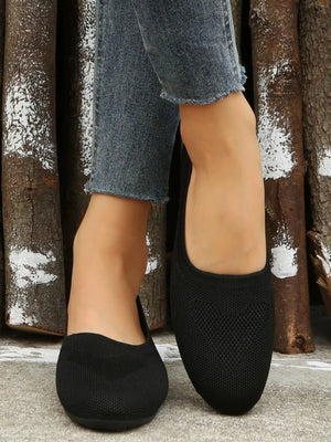 Black knit ballet flats with subtle chevron detail, comfortable slip-on style.