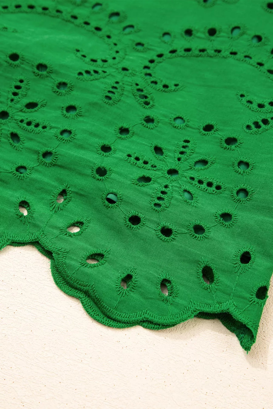 Green cotton eyelet dress with scalloped hem detail