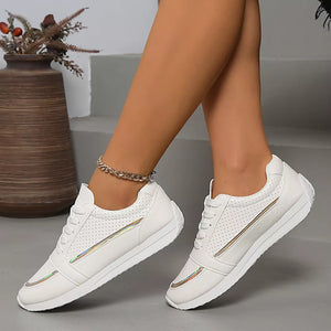 White iridescent lace-up sneakers with perforated detail and metallic stripe accents.