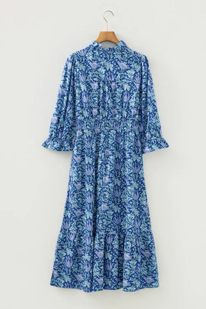 Blue floral midi dress with cinched waist and frilled cuffs
