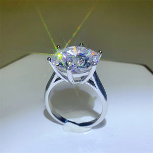 Solitaire Prism Ring in silver with a large, brilliant-cut clear stone showcasing rainbow prisms.