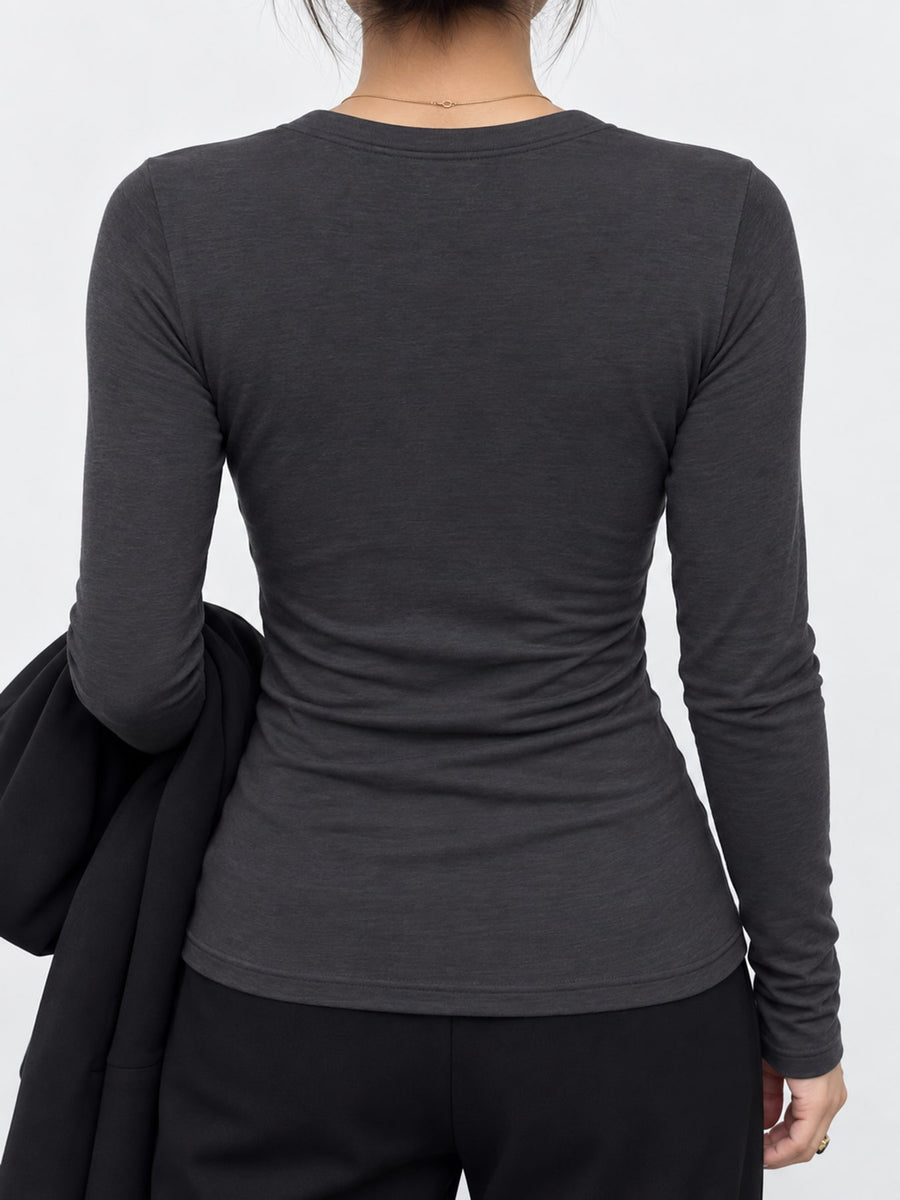 Contains 65% lyocell and less than 30% wool henley in Black with slim silhouette