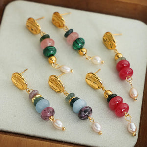 Stacked gemstone and pearl dangle earrings in light blue, green, and red with 18K gold plating.