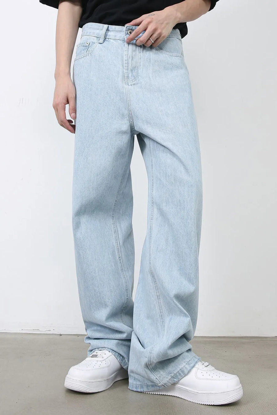 Baggy light blue denim palazzo jeans with button fly and wide leg.