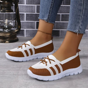 Brown and white breathable knit lace-up sneakers with striped detail.