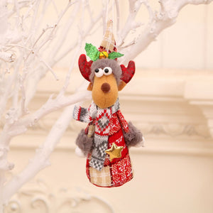Festive fabric reindeer ornament with red and white patterned sweater and scarf, gold star detail.