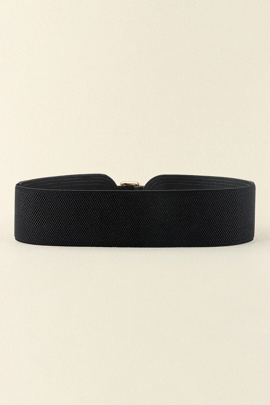 Black elasticated waist belt with gold buckle and sculpted detail