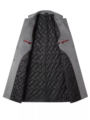 Men's grey classic overcoat with quilted black lining and red trim detail.
