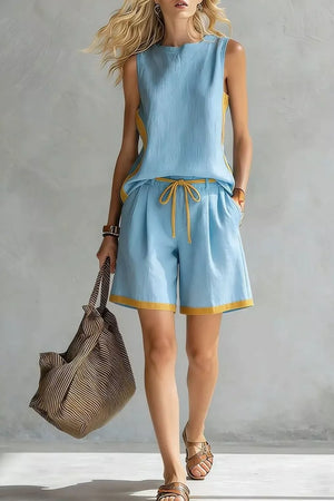 Light blue tank and shorts set with yellow contrast trim and drawstring waist.