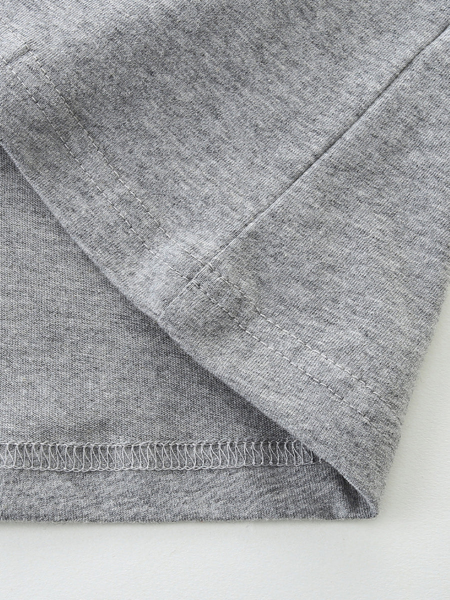 Toddler grey cotton t-shirt detail showing seams and hem.