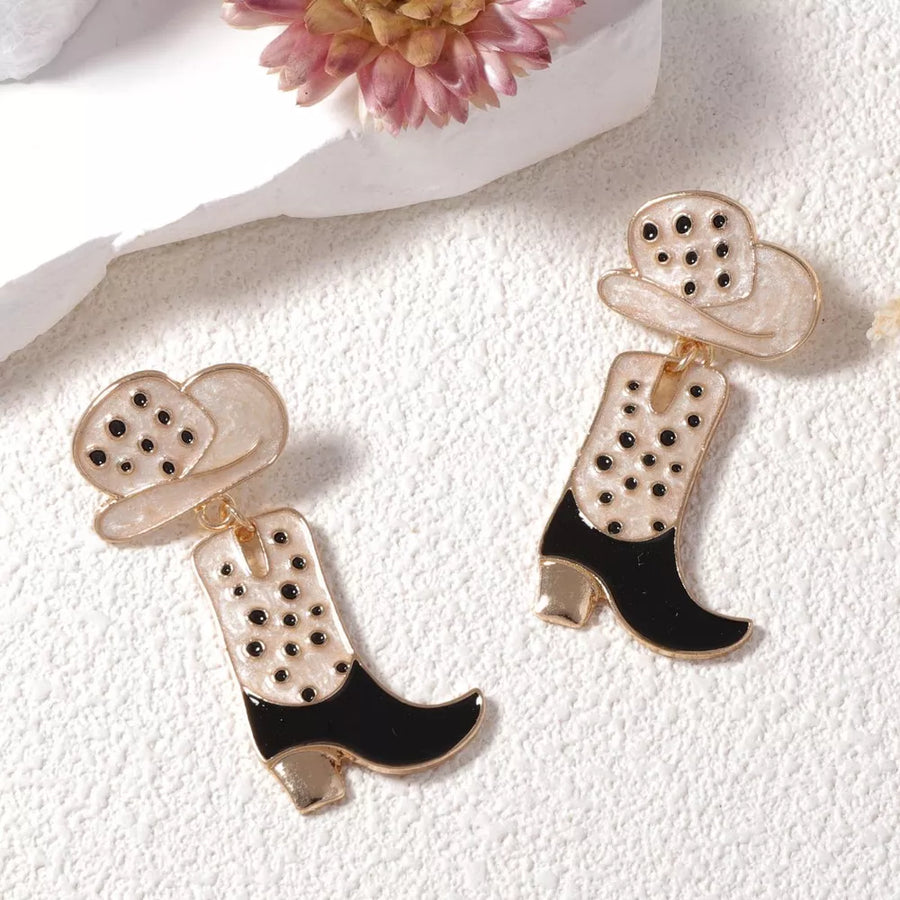 Western Charm dangle earrings with cowboy boot and hat design in white and black with gold accents