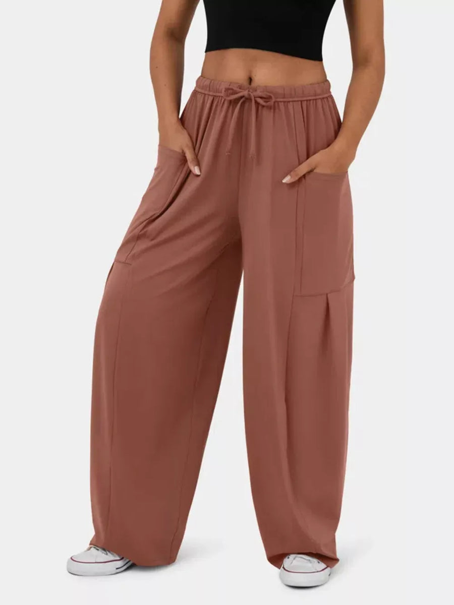 Rose Red wide-leg maternity pants with drawstring waist and pockets.