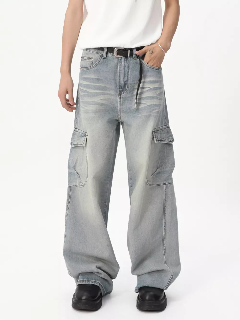 Relaxed fit light wash denim cargo jeans with vintage appeal and multiple pockets.