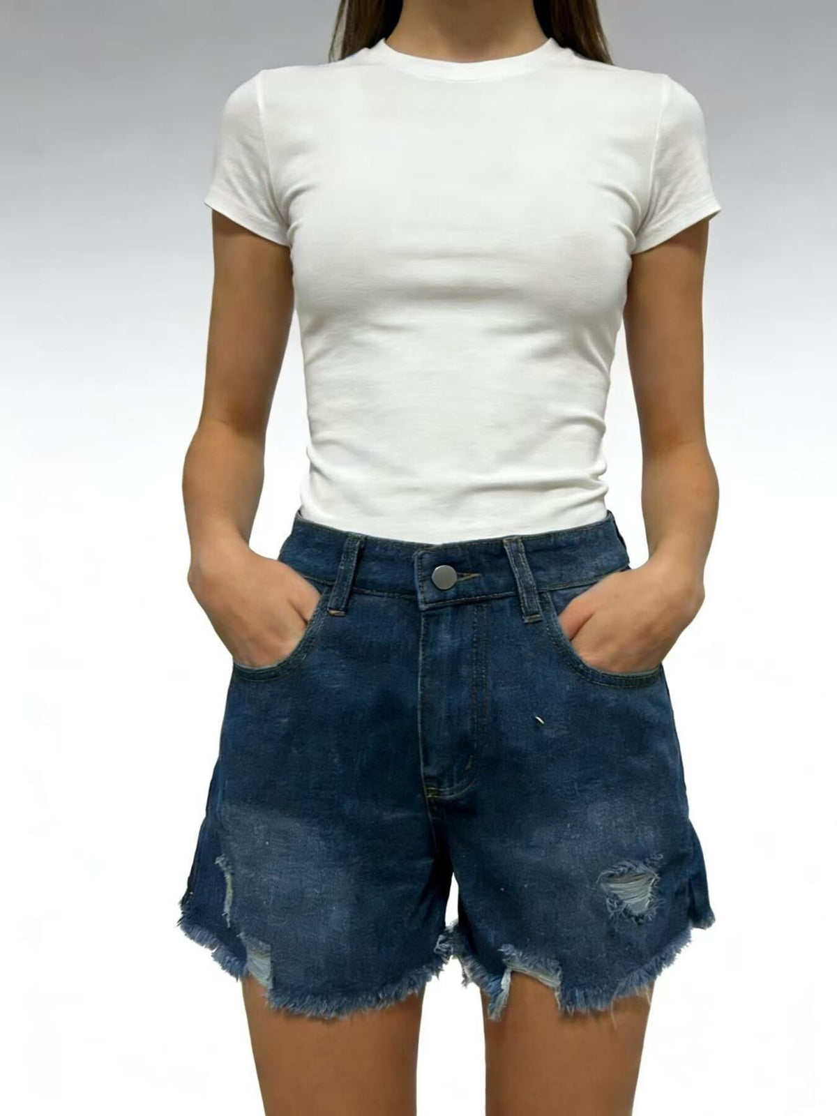 Dark blue denim shorts with distressed details and frayed hem