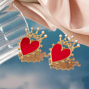 Red heart crown stud earrings with gold accents and white gems.