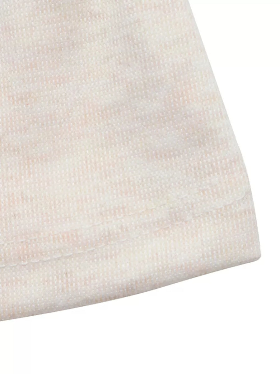 Cream knit fabric with subtle pink marled texture and visible stitching detail.