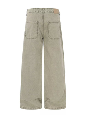 Two-tone wide-leg cargo pants in khaki color with distressed details and large back pockets.