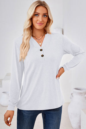 White Henley button-down knit top with a V-neck and two dark buttons.