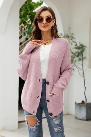 Waffle knit oversized button-front cardigan in carnation pink with pockets.