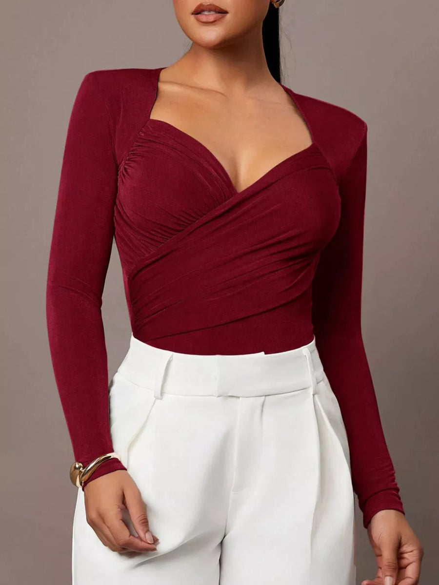 100% polyester Care instructions: Machine wash cold bodysuit in Burgundy with fitted silhouette