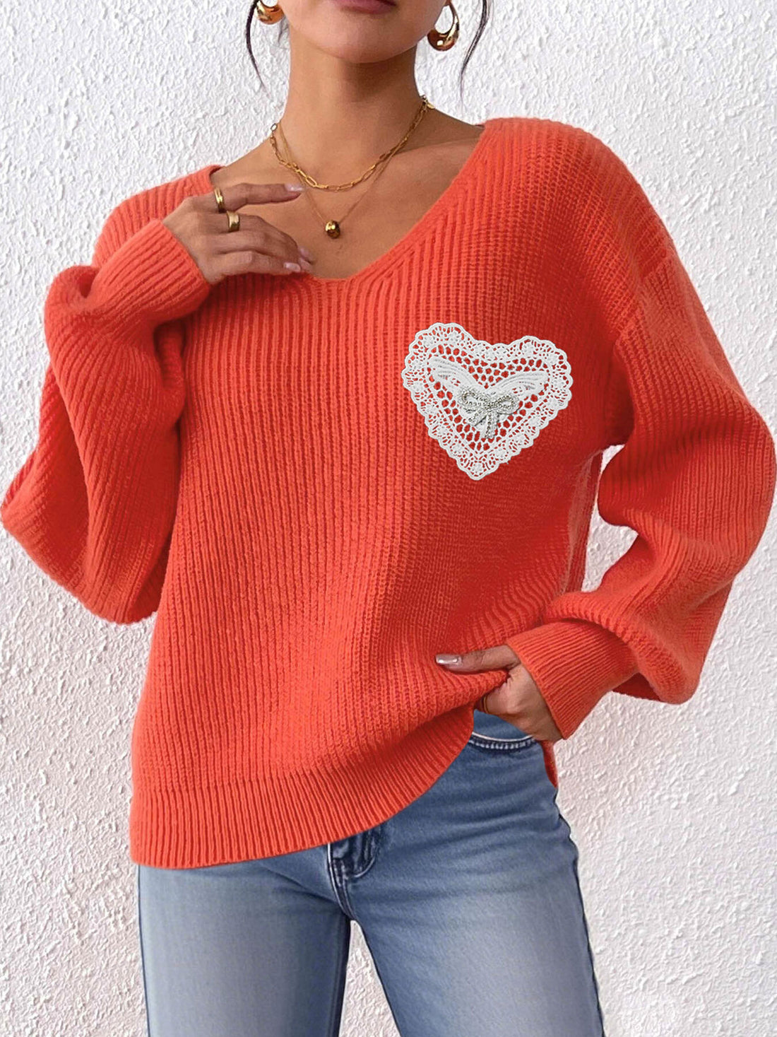 pullover sweater in bright orange featuring lace and relaxed fit