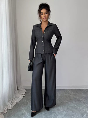 Gray button-up shirt and wide-leg pants set with button details and chest pockets.