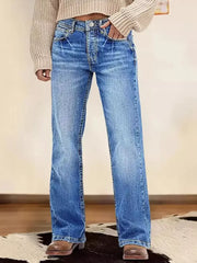 Light blue vintage wash straight leg denim jeans with button fly and whiskering detail.