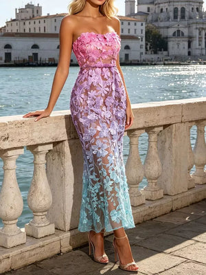 Strapless floral lace gown with ombre pink to blue gradient and sheer skirt.