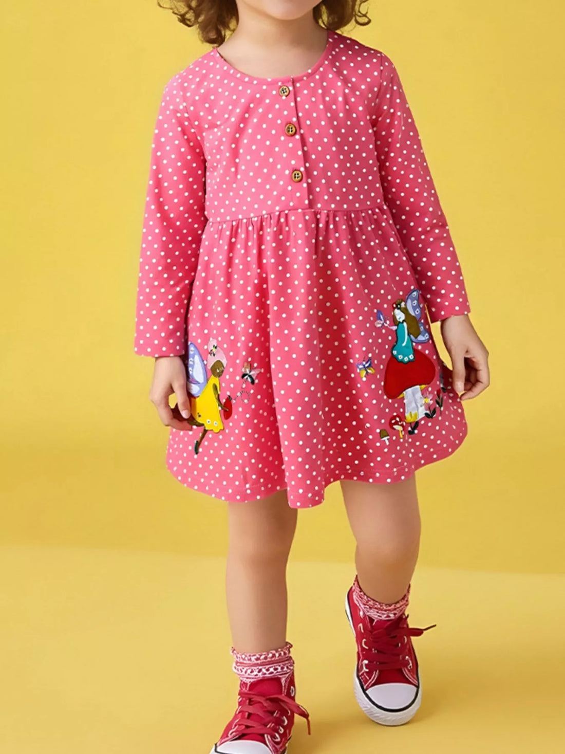 Strawberry polka dot cotton dress with fairy applique and long sleeves.