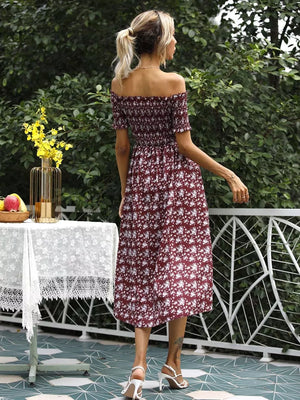 Burgundy floral off-shoulder midi dress with smocked bodice and a side slit.