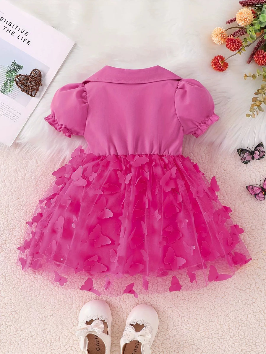Pink baby dress with collared neckline, puff sleeves, and a tulle skirt adorned with butterfly appliques.