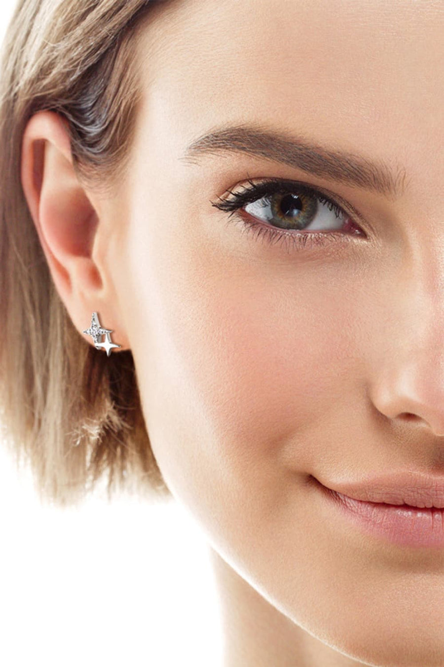 Celestial diamond burst stud earrings in silver with sparkling details.