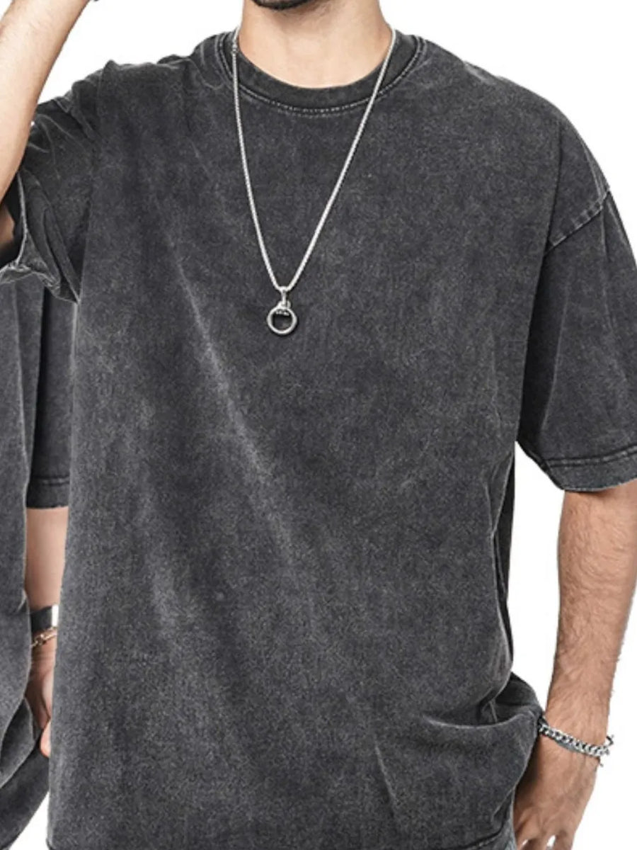 Acid wash oversized crew neck tee in Washed Black, featuring a relaxed fit and crew neckline.