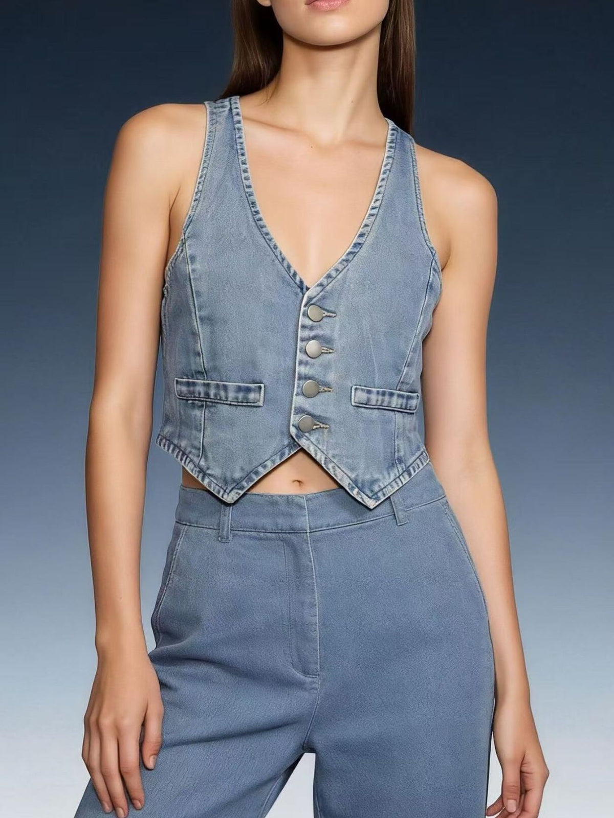 Light blue denim cropped button-down vest with V-neck and two chest pockets.