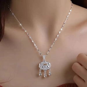 silver necklace with ornate and not applicable