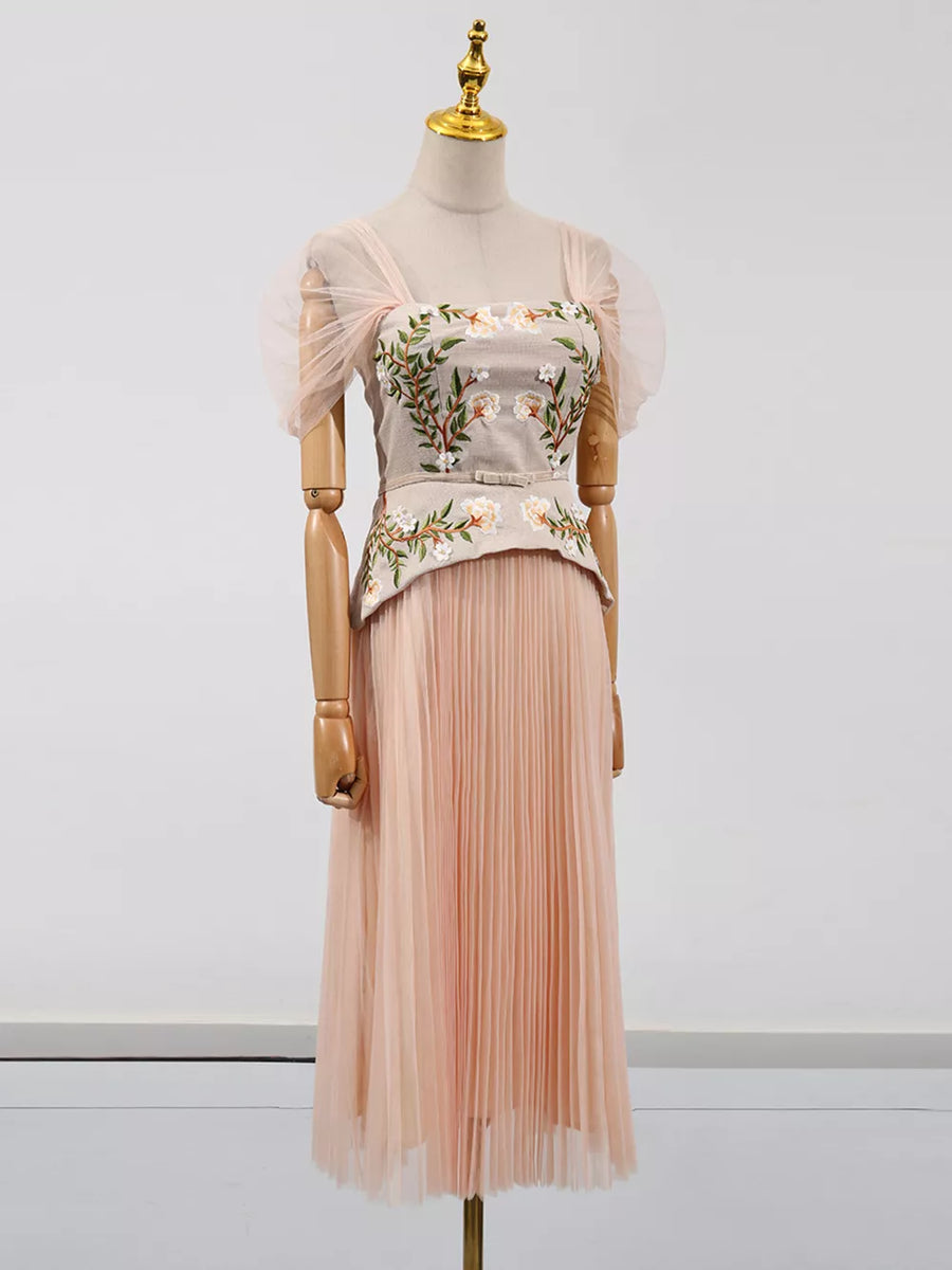 Embroidered tulle midi dress with sheer puff sleeves and a pleated skirt.